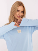 Šviesiai mėlyna oversize medvilninė palaidinė.