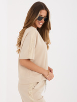 Beżowa bluzka oversize z krótkim rękawem