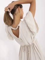 Jasnobeżowa letnia sukienka z guzikami na plecach 