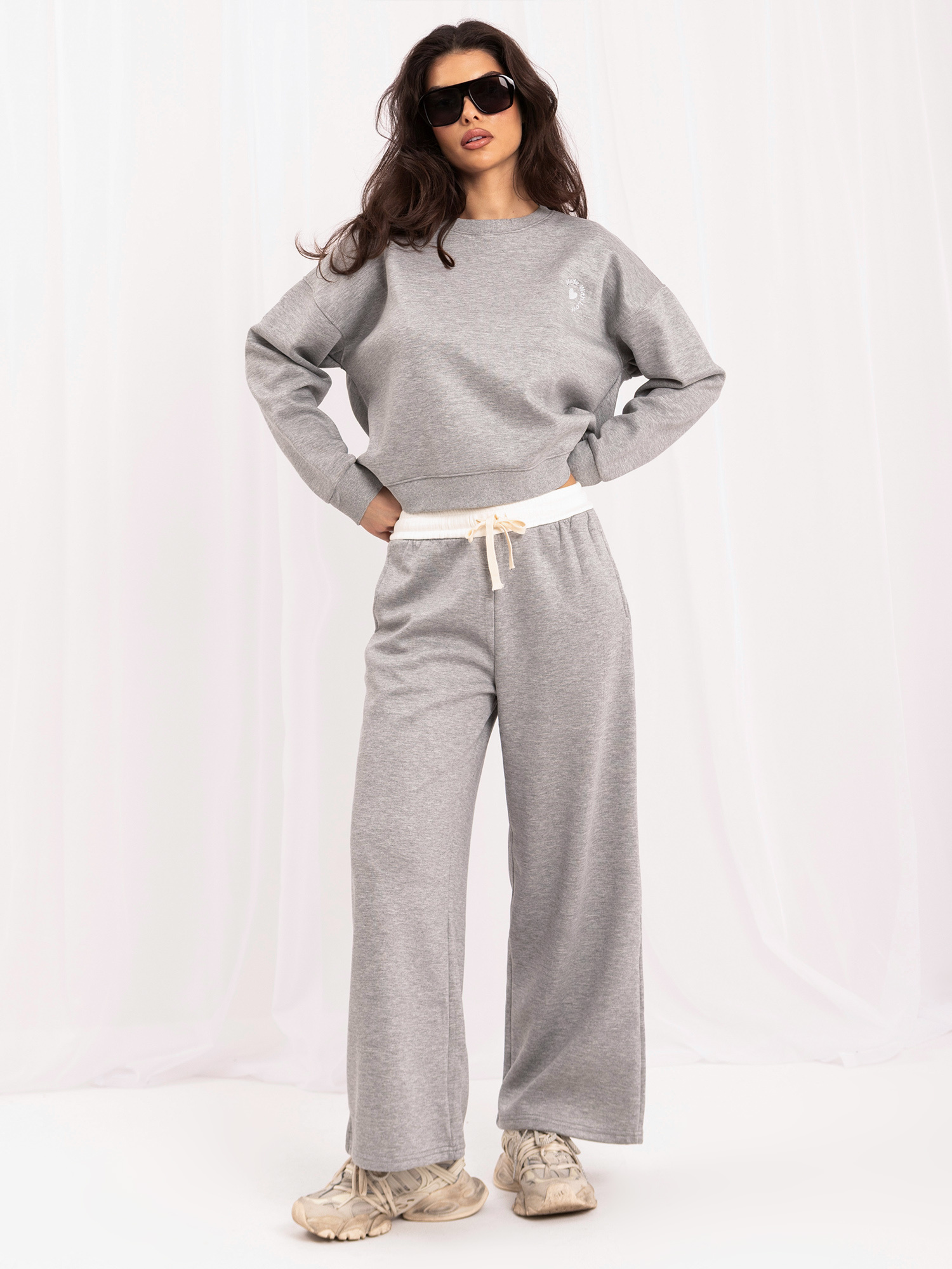 Gray tracksuit set with a contrasting stripe.