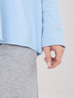 Světle modrá dámská oversized mikina.