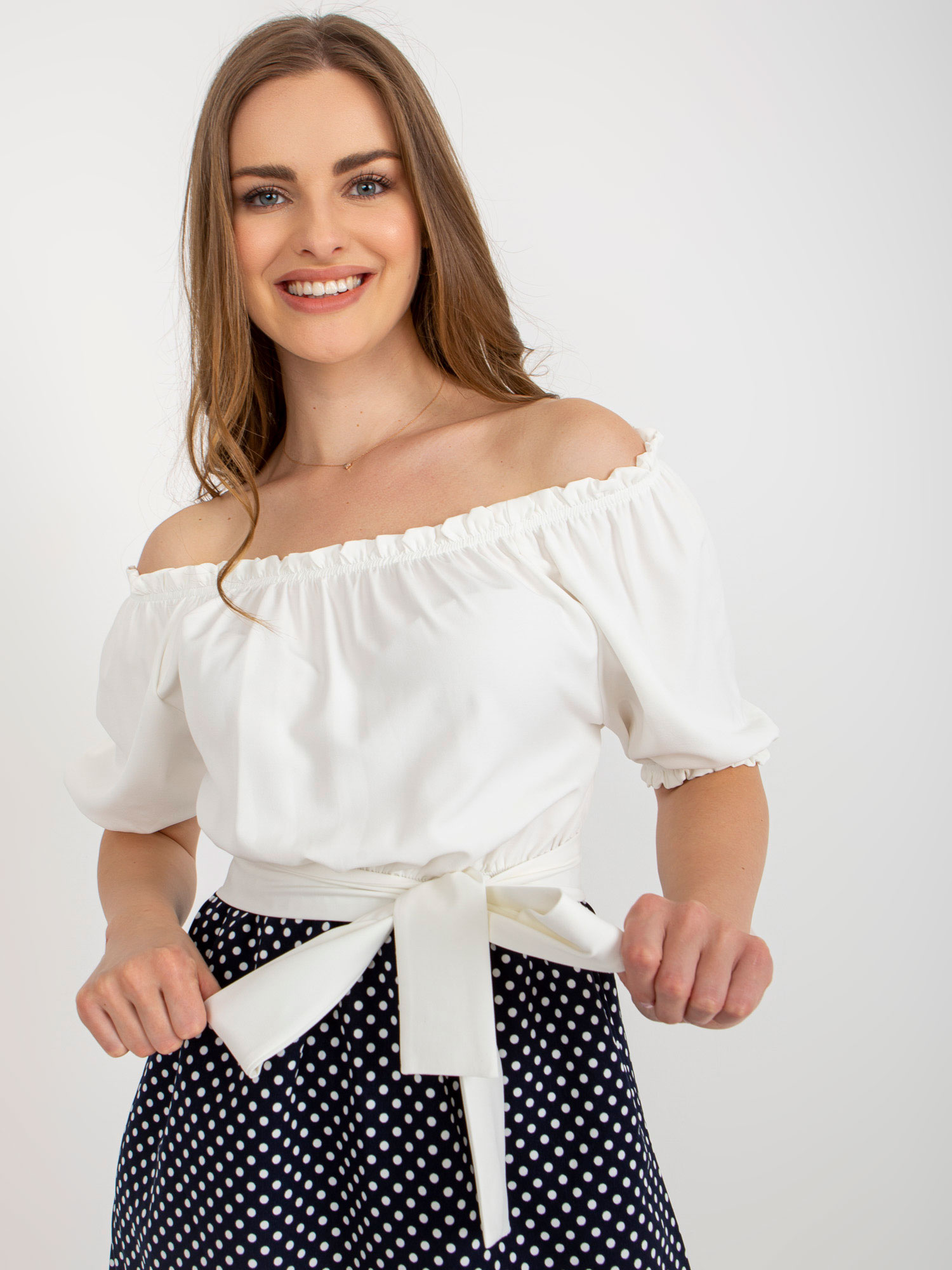Hurt Ecru-navy cocktail dress off-the-shoulder with a belt.