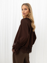 Brown shirt blouse with gathered neckline.