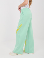 Miętowe dresowe spodnie z prostą nogawką RUE PARIS 