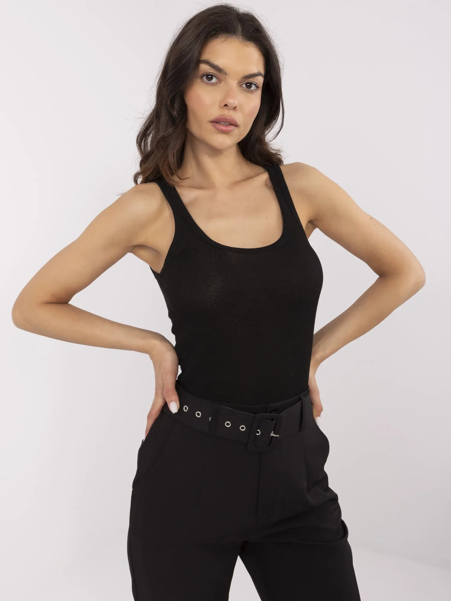 Black women's top with metallic thread.