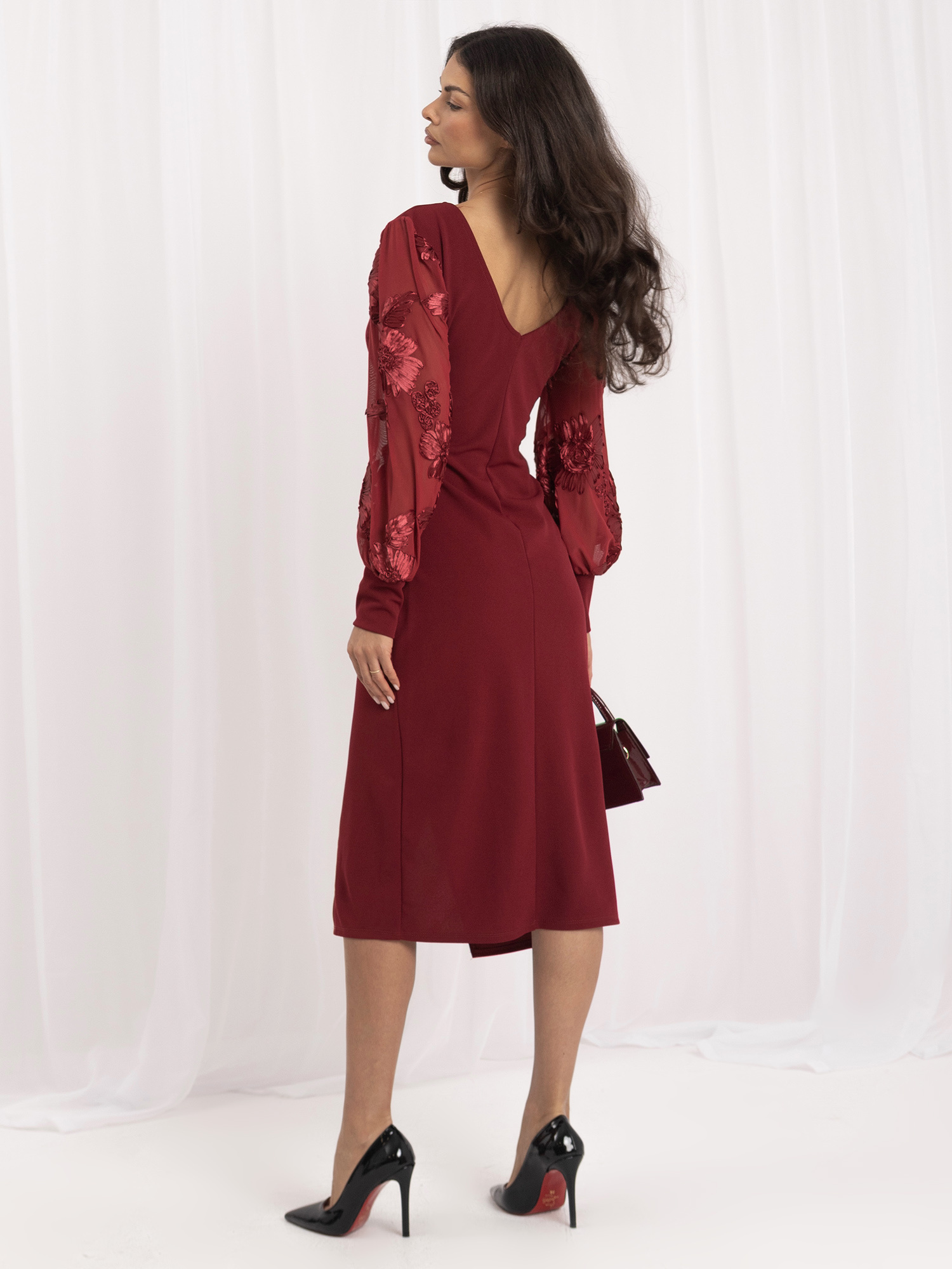 Burgundy wrap dress with draping.