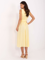 Light yellow summer dress with a belt.