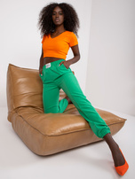 Zielone damskie spodnie z materiału w kant 