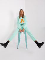 Hurt Miętowo-fluo pomarańczowy komplet dresowy z literą A