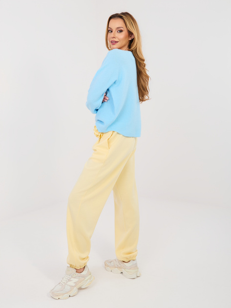 Pastelowe żółte dresowe spodnie typu jogger