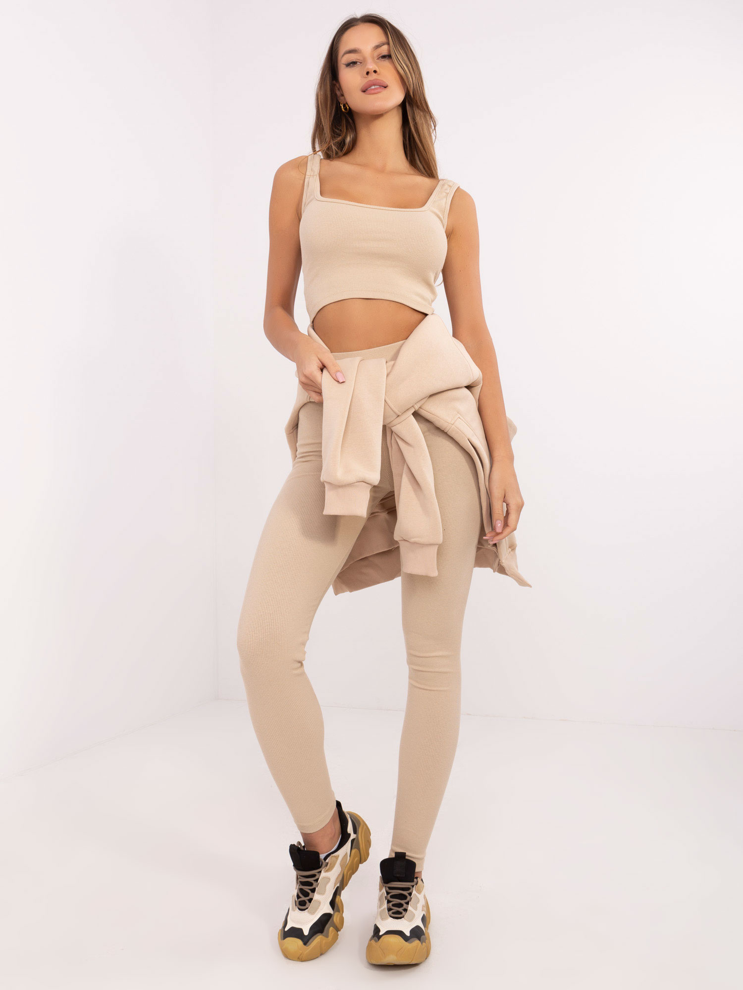 Beige three-piece set with a warm hoodie.