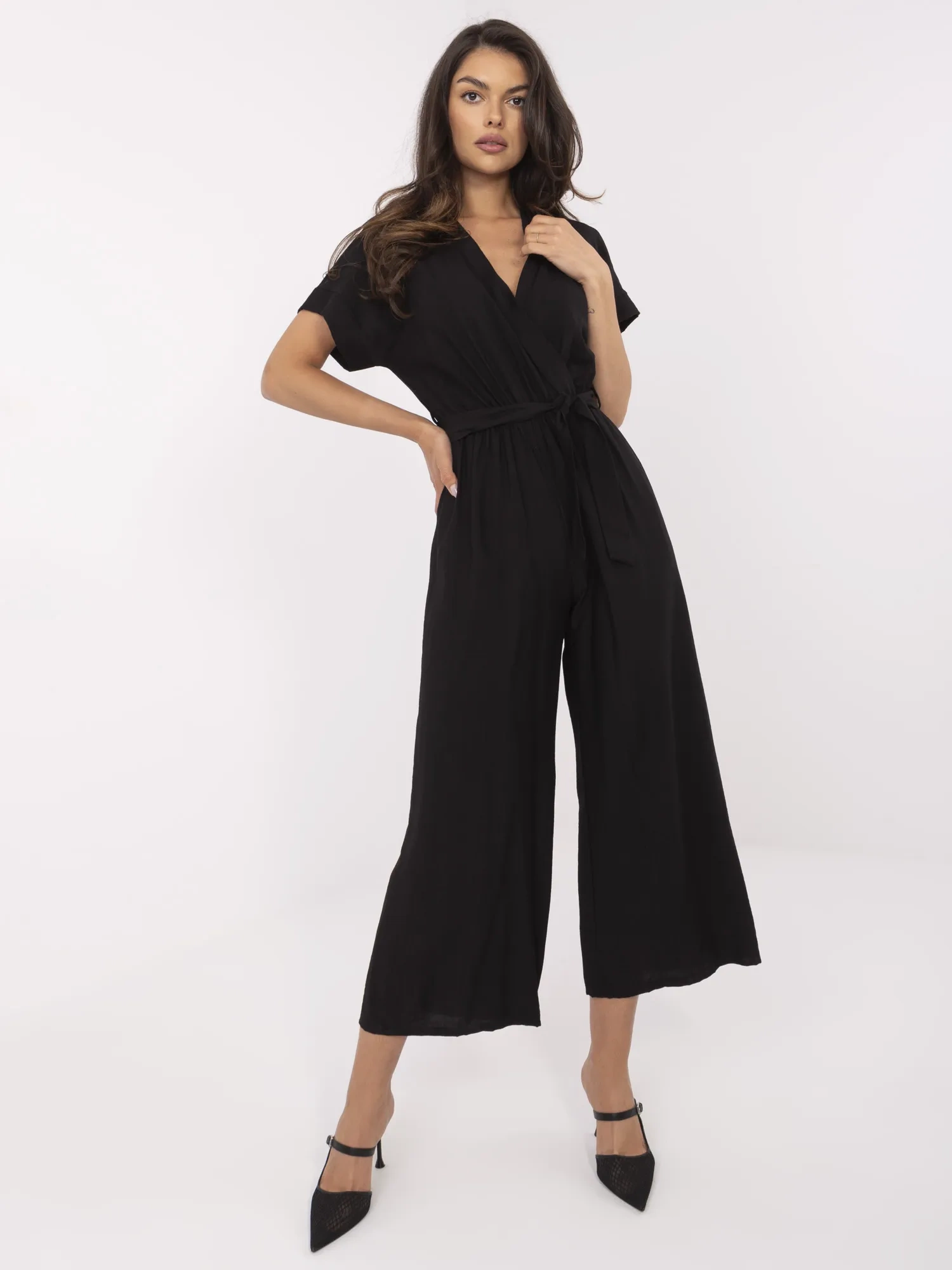 Black jumpsuit with a wrap neckline.