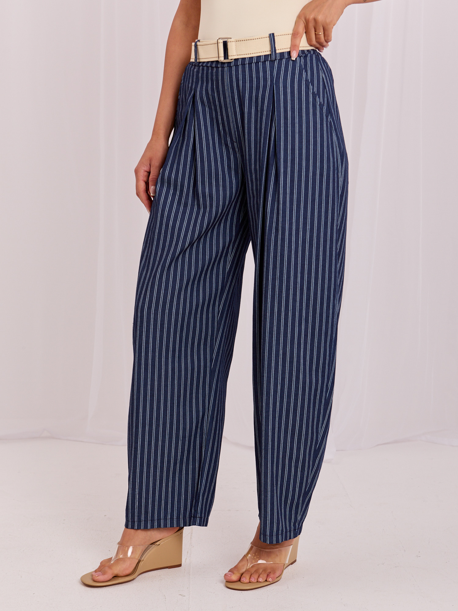 Navy summer pants with a belt.