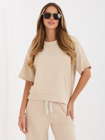 Beżowa bluzka oversize z krótkim rękawem