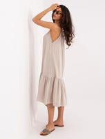 Beige flared dress with a ruffle.