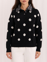 Black women's oversized polka dot sweater.