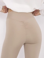 Beige women's leggings with ruching at the back.