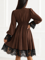Brown dress with lace trim.