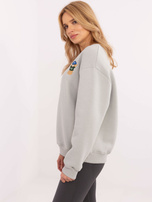 Hurt Jasnoszara bluza oversize z naszywką misia