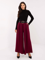 Burgundy wide trousers with pleats.