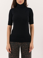 Black turtleneck sweater with decorative buttons on the sleeves.