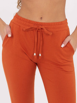 Ciemnopomarańczowe spodnie Faster