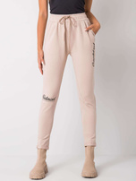 Beżowe spodnie dresowe z napisami Haylee