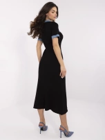 Black knit dress with denim inserts.