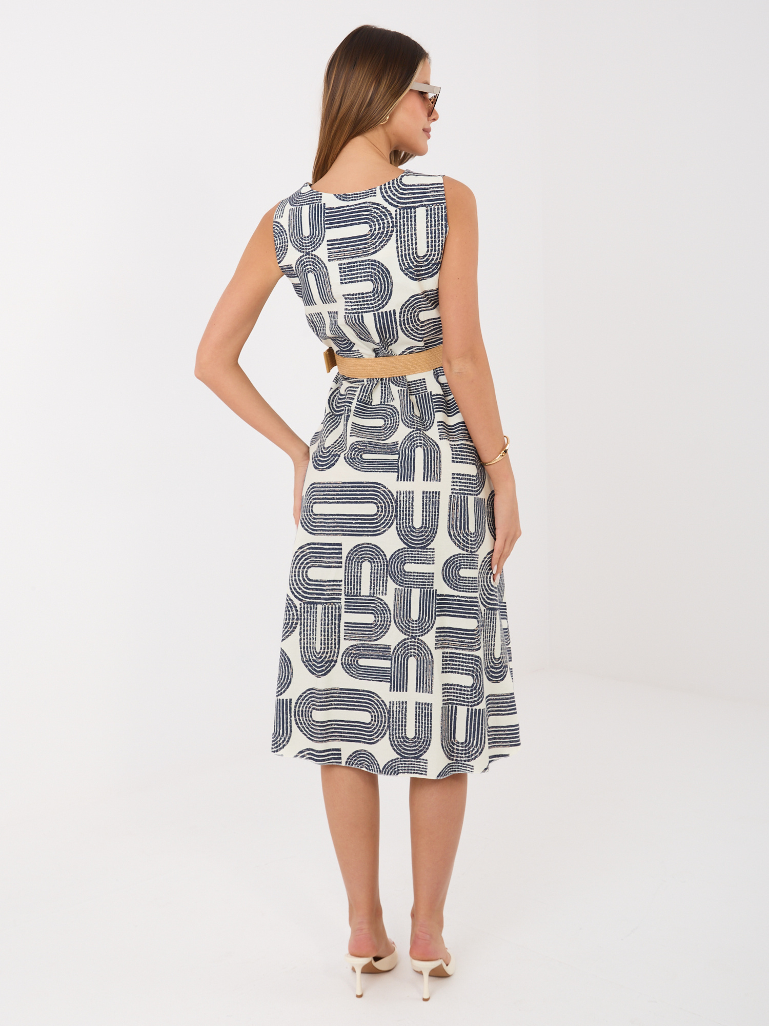Navy blue flared sleeveless dress.