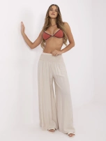 Beige summer pants with a wide elastic band.