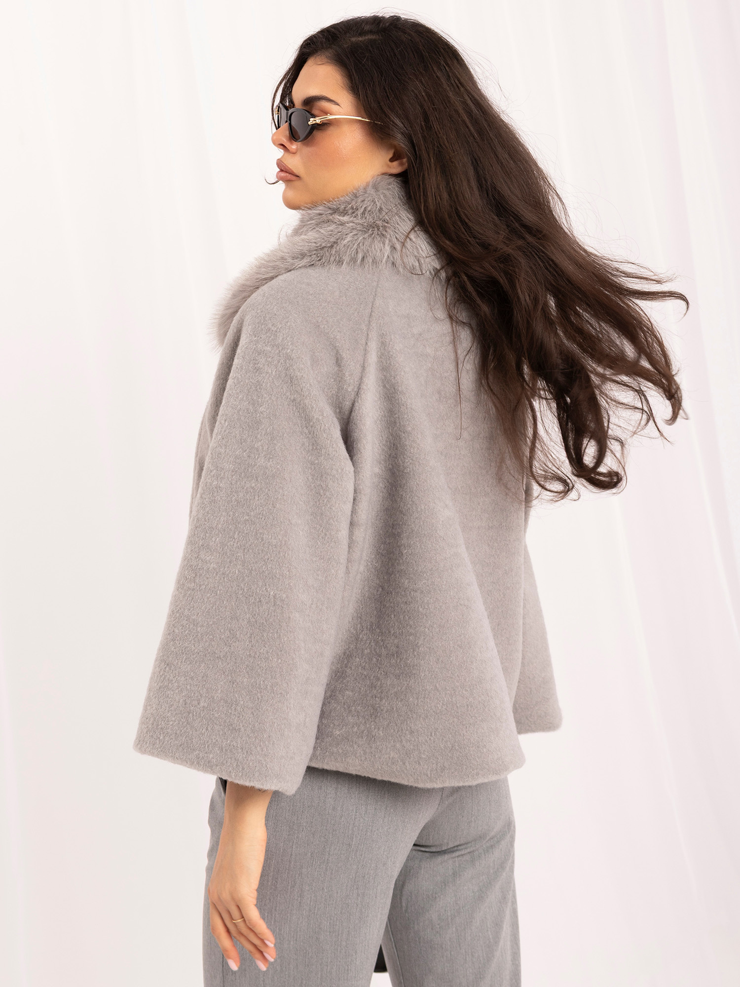 Gray trapeze coat with wide sleeves.