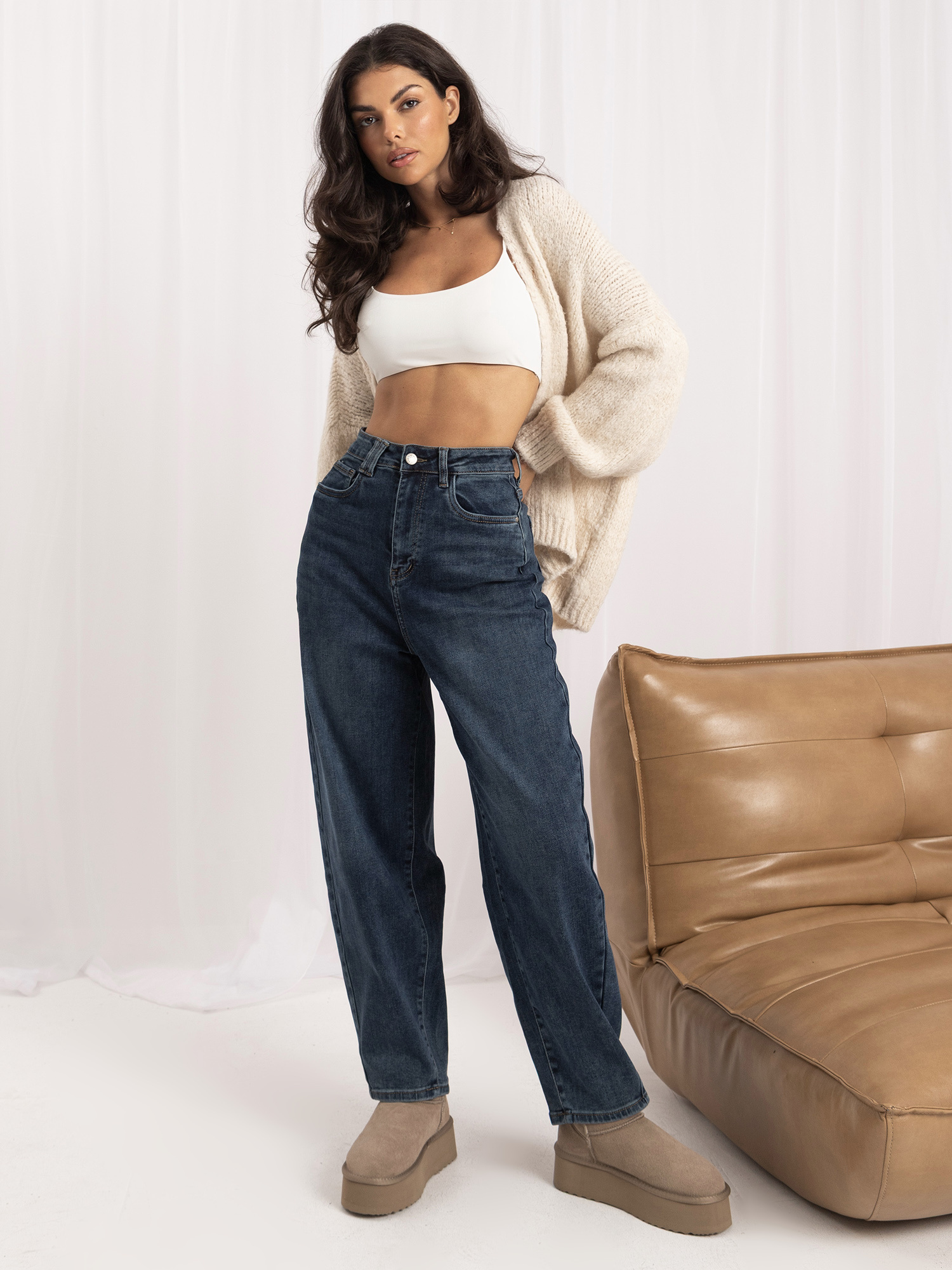 Dark blue balloon jeans with a high waist.