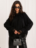 Black elegant blouse with puffed sleeves.