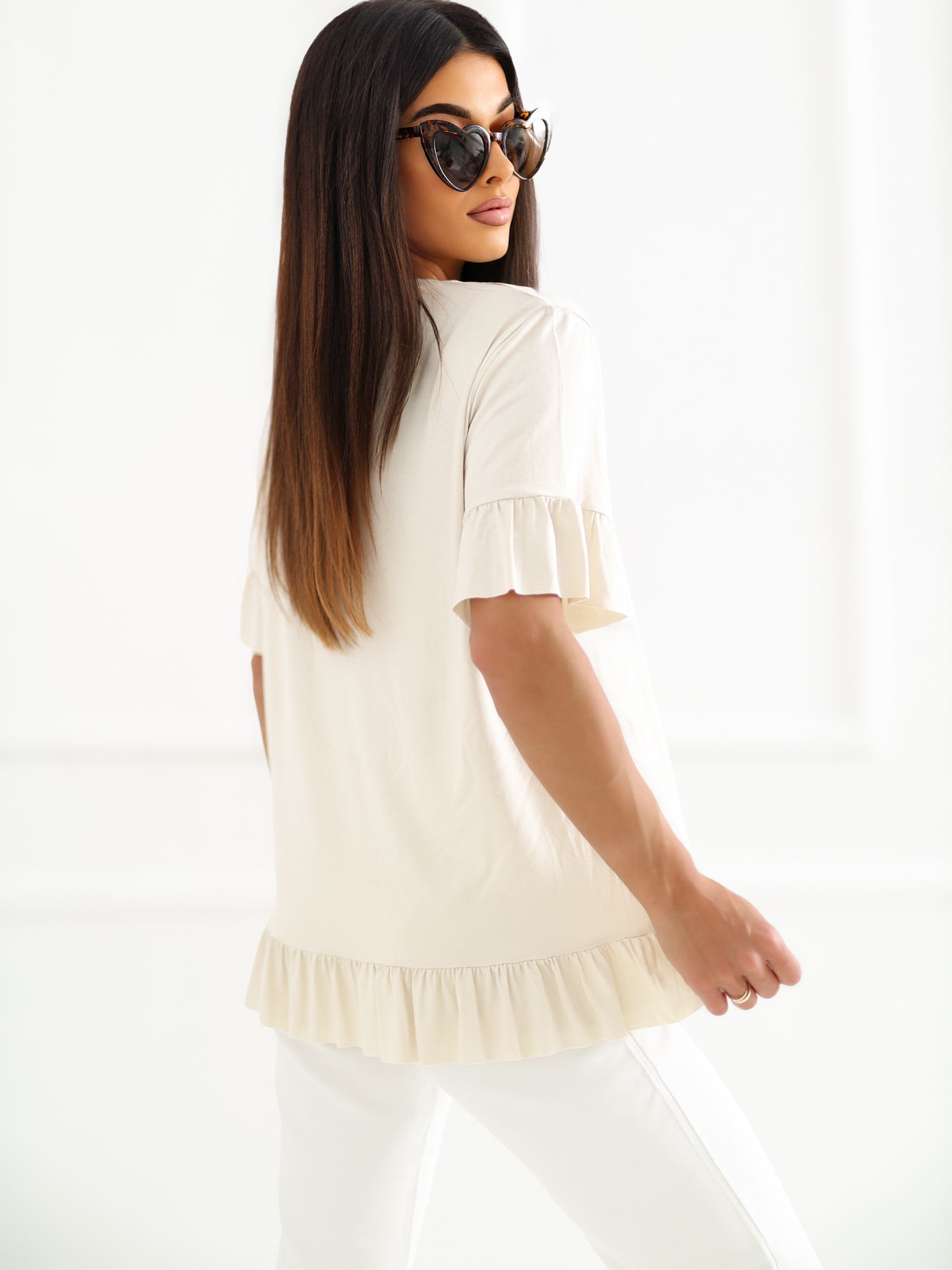 Light beige women's oversized blouse made of viscose.