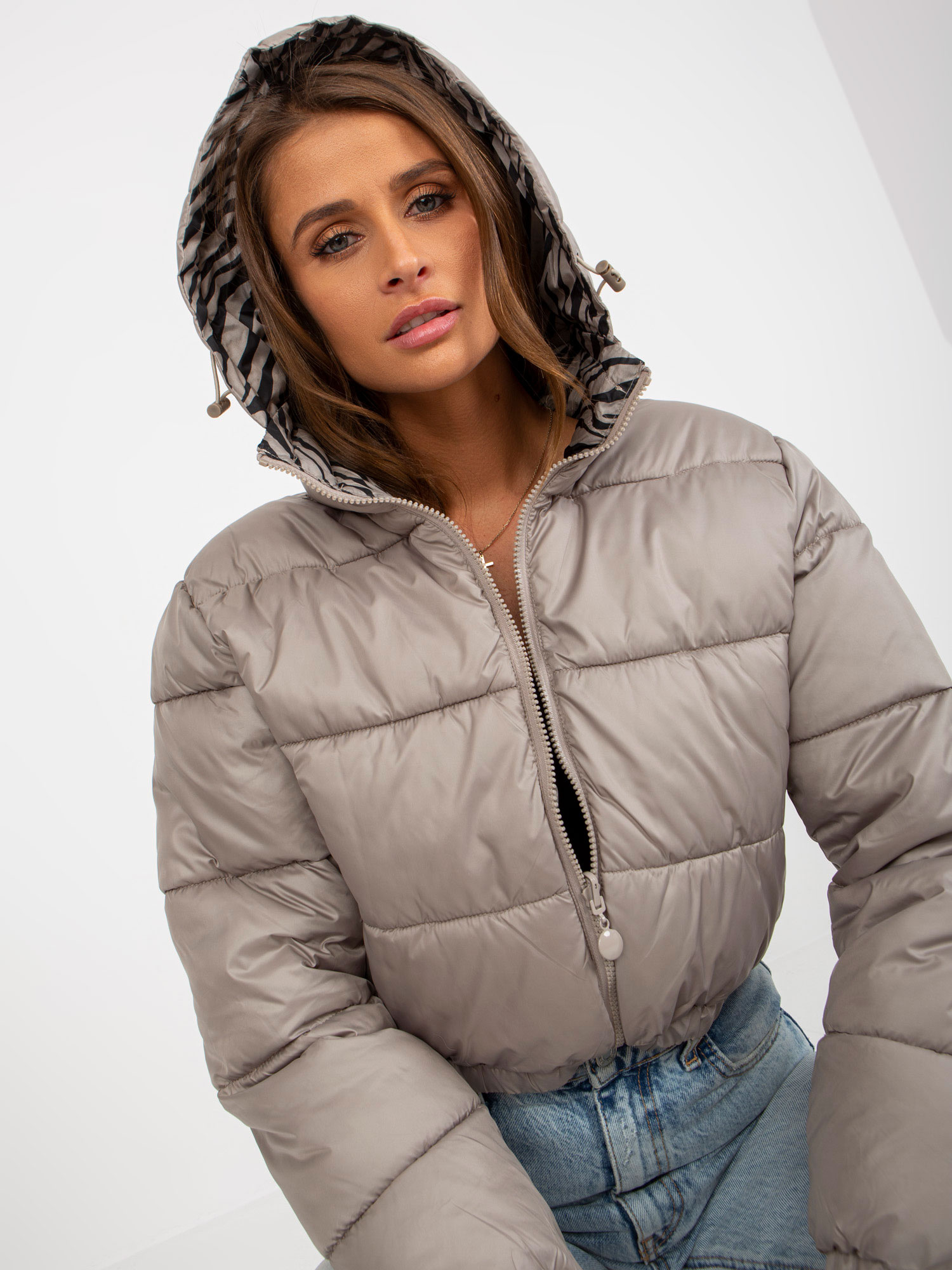 Hurt Dunkelbeige beidseitig gepolsterte Jacke im Tiermuster.