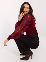 Burgundy sweater made of ribbed knit.