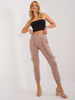 Hurt Ciemnobeżowe spodnie dresowe z ozdobnymi szelkami