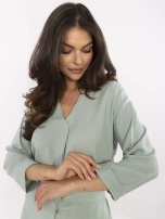 Pistacjowa luźna bluzka z dekoltem V SUBLEVEL