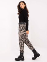 Beżowe damskie spodnie w zebrę