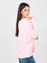 Jasnoróżowa damska bluzka oversize z kieszenią
