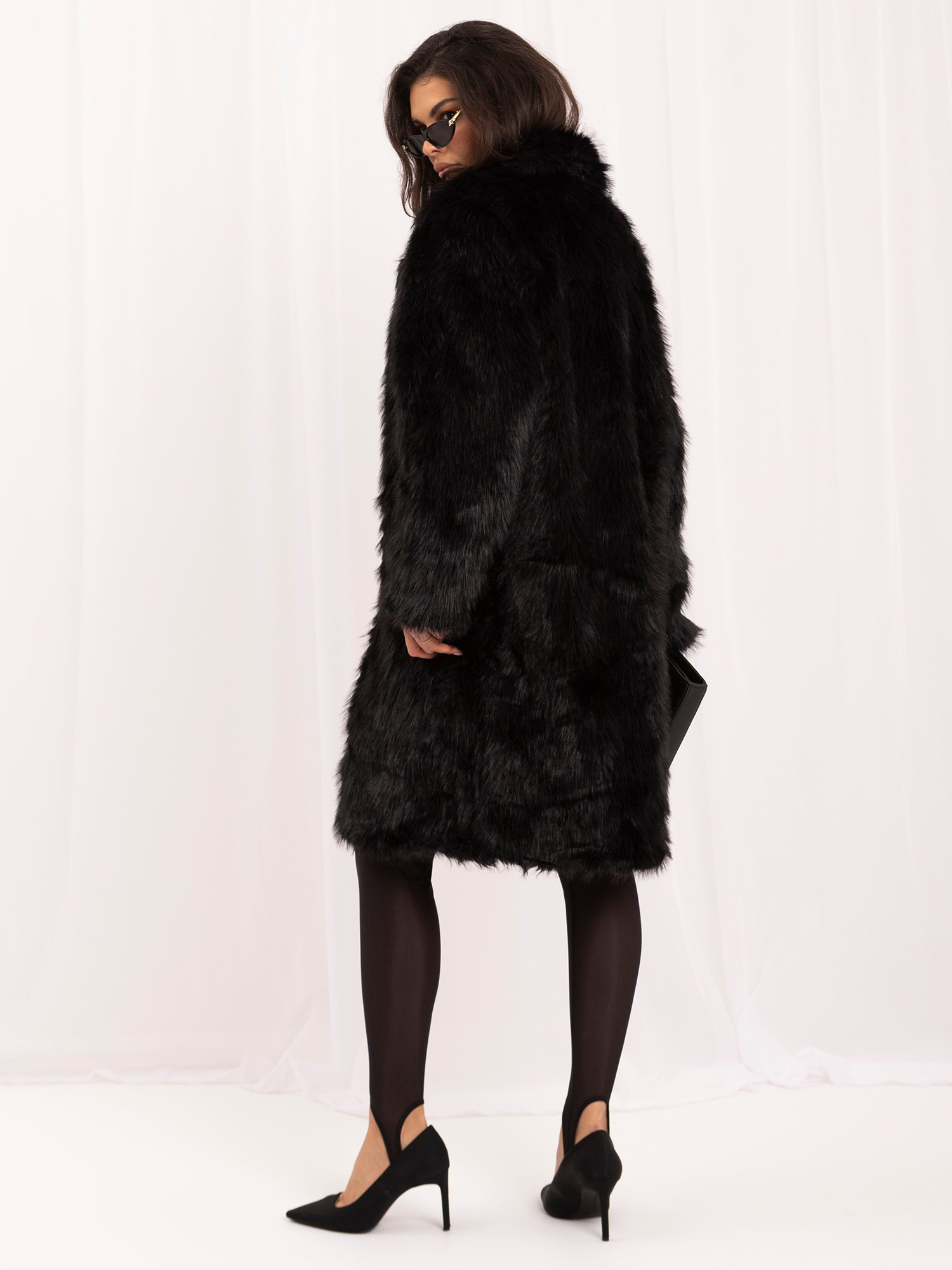 Black winter coat made of soft eco-fur.
