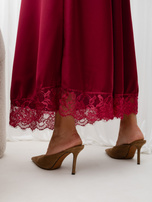 Burgundy midi skirt with elastic made of satin imitation.