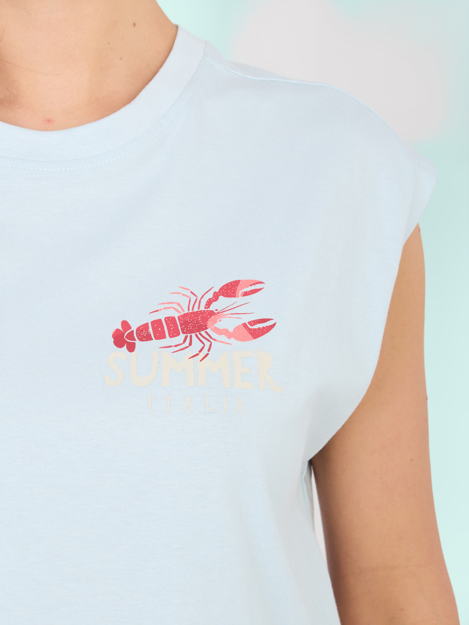 Pastelowy niebieski t-shirt  z nadrukiem na plecach SUBLEVEL