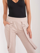 Hurt Beżowe spodnie dresowe z kieszeniami