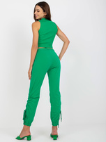 Green cotton sweatpants with cuffs.