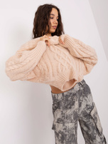 Light beige sweater with braids in a loose fit.