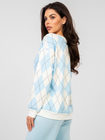 Pastel blue sweatshirt with geometric patterns.