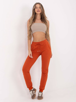 Ciemnopomarańczowe spodnie Faster