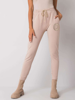 Beżowe spodnie dresowe z nadrukiem Larissa