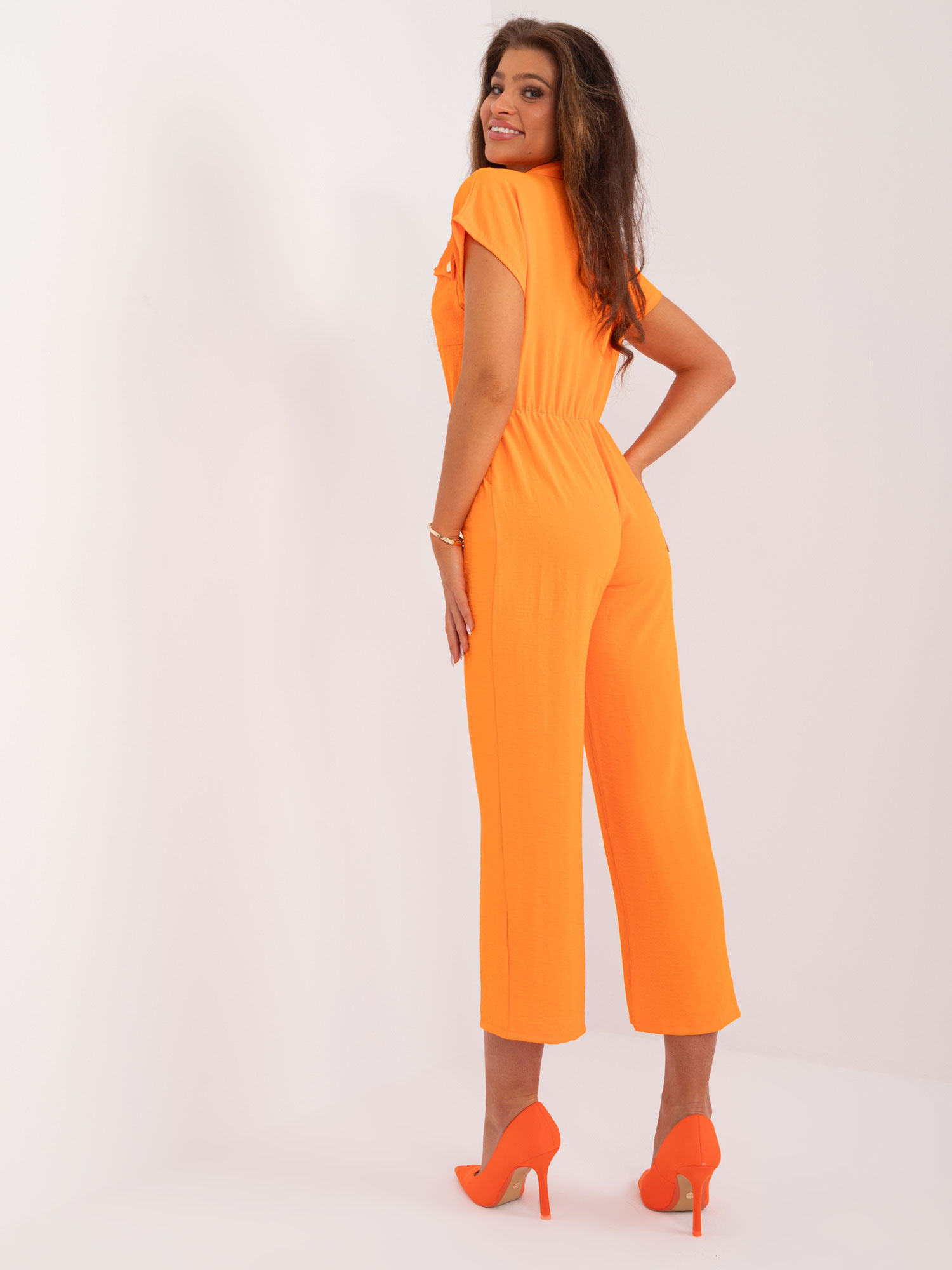 Hurt Orange jumpsuit with pockets.